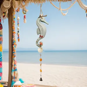 Mediterranean seahorse wind chime wall hanging decoration shown in a sunny beach setting