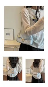 Detailed views of a light blue quilted chain shoulder bag with oil-skin texture.