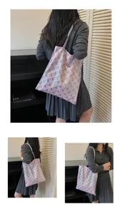 Close-up of purple sequin tote bag with geometric fish scale embroidery