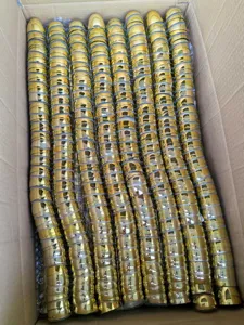 Detailed view of bulk golden electroplated plastic Easter eggs packed in a storage box