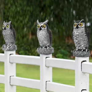 Set of 3 realistic plastic owl decoys on a white fence for garden and porch bird scaring