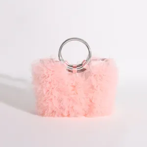 Detailed macro view showing soft pink ruffled tulle texture on sweet style handbag