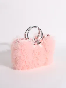 Close-up of elegant pink ruffled tulle handbag featuring shiny silver metal ring handles