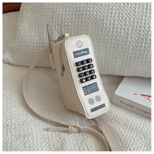 Creative vintage telephone-shaped shoulder bag in cream with realistic buttons
