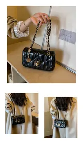 Close-up of black quilted oil skin crossbody bag with gold chain strap