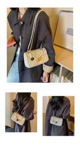 Multiple wearing views of a cream quilted oil leather flap bag with metal chain strap