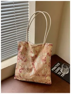 Detail view of fashion tote bag with geometric embroidery and multi-color sequins