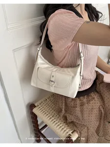 Vintage cream oil wax leather underarm shoulder bag for women in stylish lifestyle setting