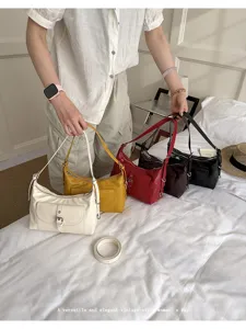 Collection of vintage oil wax leather shoulder bags in white, yellow, red, and black