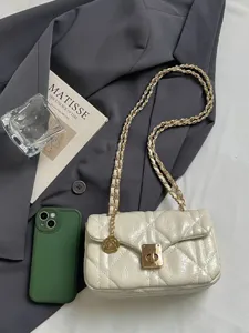 Elegant cream quilted leather crossbody bag with golden chain strap and rose charm