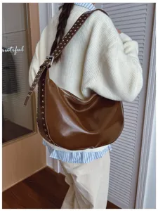 Retro brown hobo shoulder bag with metal rivets, large capacity casual underarm bag for women.