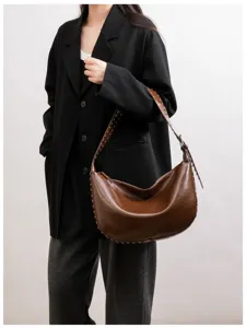 Stylish brown faux leather hobo shoulder bag with chic metal rivet details for women.