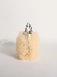 Detailed view of champagne pleated tulle handbag with silver circular metal handles