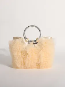 Detailed view of sweet style handbag featuring pleated tulle ruffles and silver ring handles