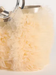 Detailed view of sweet style champagne ruffled tulle handbag with metallic silver ring handles