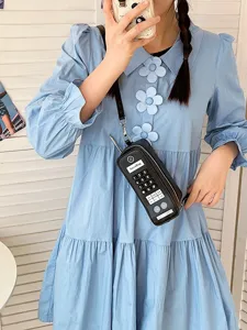 Creative retro brick phone shaped crossbody bag for women in black with numpad detail