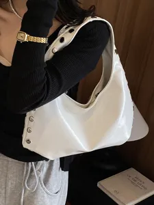 Chic white glossy PU underarm bag with silver rivet detailing in a cool punk style