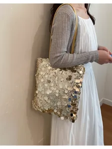 Fashionable large gold sequin shoulder bag shown on model for daily commuting use