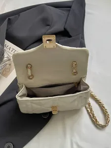 Elegant cream quilted oil-skin flap square bag with gold chain strap detail for women