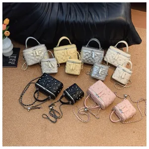 Collection of multi-color quilted box handbags with studs and chain straps in various sizes