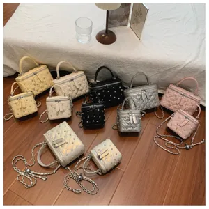 Elegant collection of quilted faux pearl chain box bags available in various colors and sizes