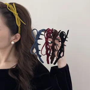 Detail view of retro flocked bow headbands showing various colors and textures