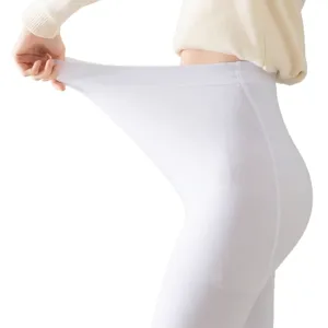 Leggings d'hiver blancs à haute élasticité pour femmes avec taille extensible et épaisse.