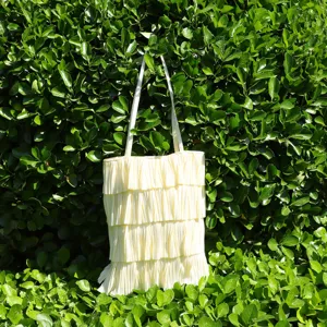 Close-up of the delicate multi-layer pleated ruffles on this soft summer tote bag