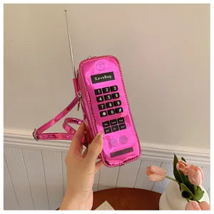 Creative metallic pink retro mobile phone shaped crossbody bag with tactile numeric buttons
