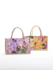 Detailed view of elegant handmade floral sequin embroidery on stylish jute tote bags