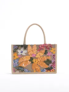 Front detail of embroidered jute tote bag with shimmering sequin flowers