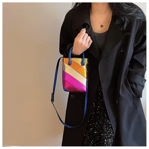 Metallic multi-color diagonal striped PU leather bucket bag with top handle and strap