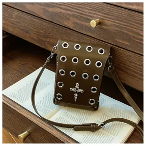 Gothic dark style crossbody bag with skull cross detail and silver metal grommets