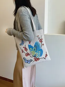 Freizeit-Canvas-Shopper Umhängetasche mit blauem Schmetterling und Pflaumenblüten-Druck.