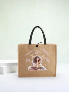 Detailed view of eco-friendly jute tote bag featuring a cute cartoon girl print design