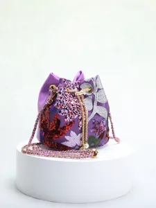Detailed view of elegant purple bucket bag with intricate floral embroidery and sequins.