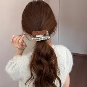 Vintage plaid bow scrunchie hair tie for ponytail in autumn winter preppy style.