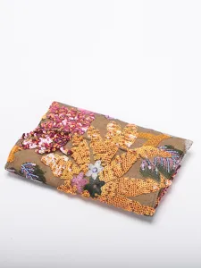 Detailed macro shot of intricate floral sequin embroidery on luxury evening clutch bag