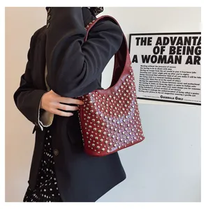 Punk style dark red shoulder bag featuring silver rivet stud embellishments in detail