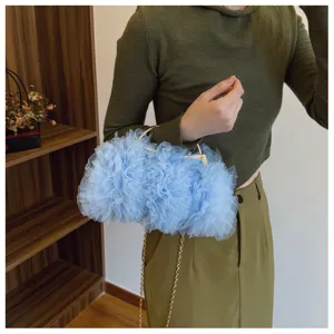 Elegant light blue tulle ruffled evening clutch bag with gold chain for weddings.