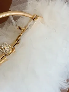 Elegant white tulle ruffle bridal handbag with gold handle and rhinestone clasp