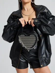 Black heart-shaped studded crossbody bag with metallic chain details and smooth faux leather finish.