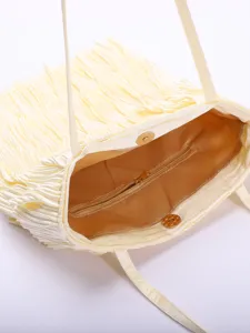 Internal view of cream pleated tote bag showing zipper pocket and magnetic closure