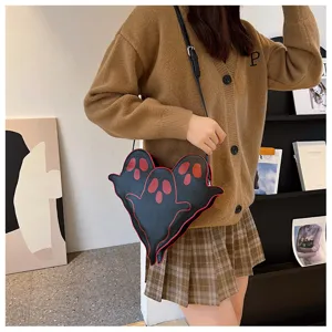 Detail shot of the Halloween ghost crossbody bag worn with a brown cardigan outfit.