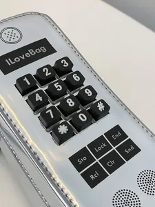 Retro mobile phone shaped creative silver crossbody bag featuring realistic keypad details