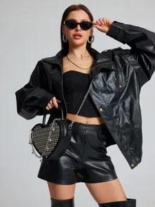Trendy heart-shaped studded crossbody bag for women with metallic chain and stylish design.