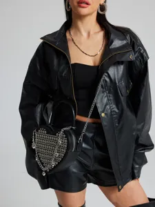 Black heart-shaped handbag with silver rivets and chain strap, edgy fashion accessory.
