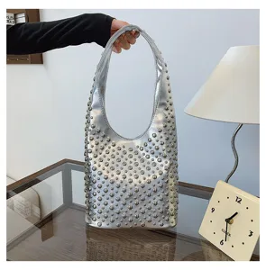 Stylish silver punk style hobo bag featuring decorative round rivet studs design