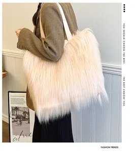 Close-up of a large pink faux fur tote bag showing long plush texture on a model