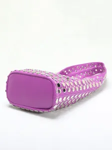 Purple punk bucket bag with silver stud embellishments, detail view of the base.
